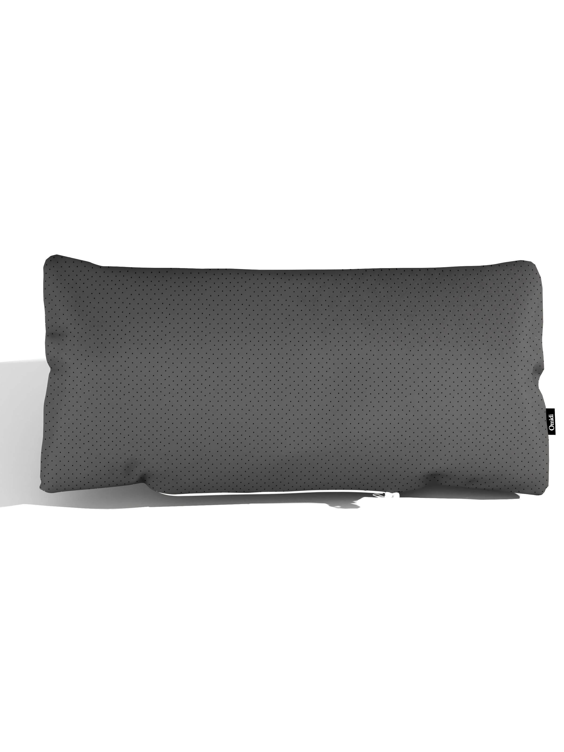 Black full-grain leather cushion with dotted texture and side tag