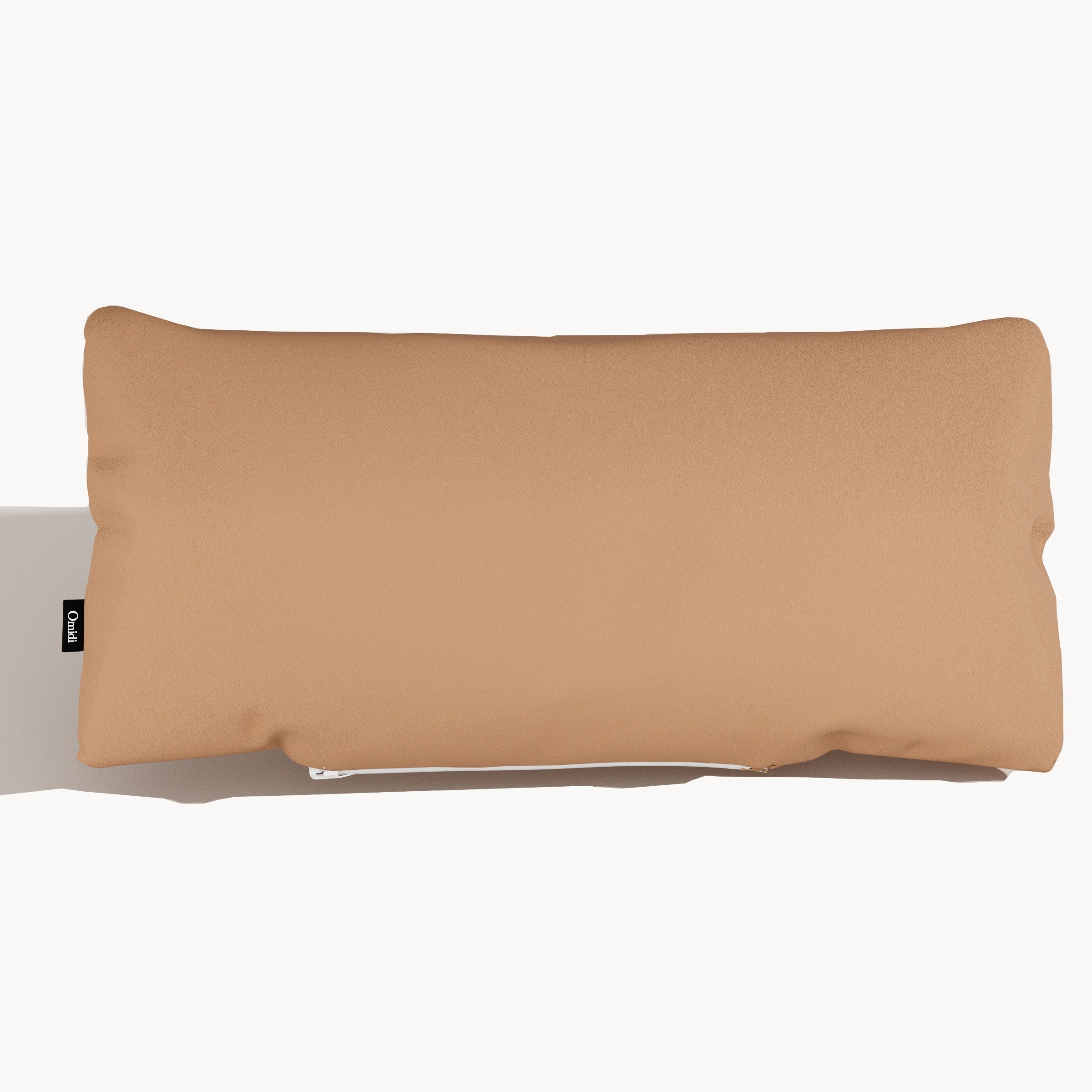 Camel full-grain leather cushion with smooth surface and side tag