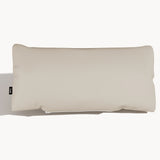 Cream full-grain leather cushion with smooth surface and side tag