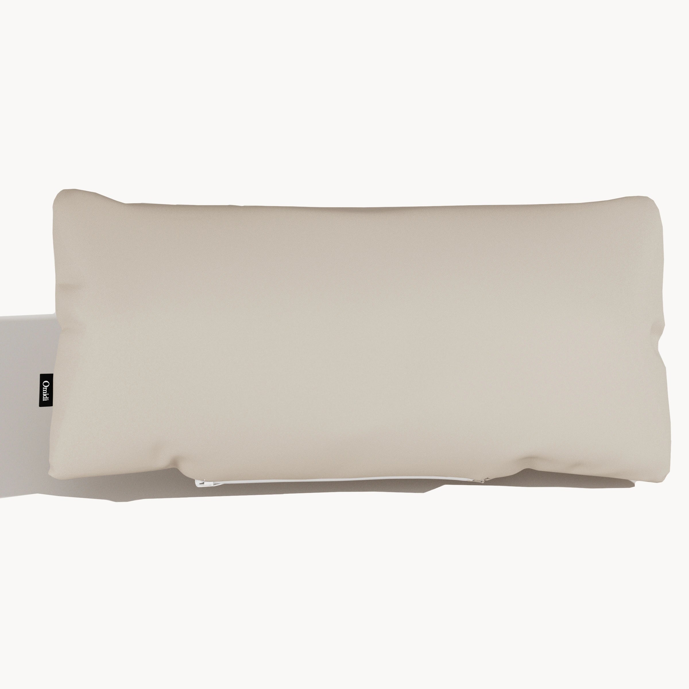 Cream full-grain leather cushion with smooth surface and side tag