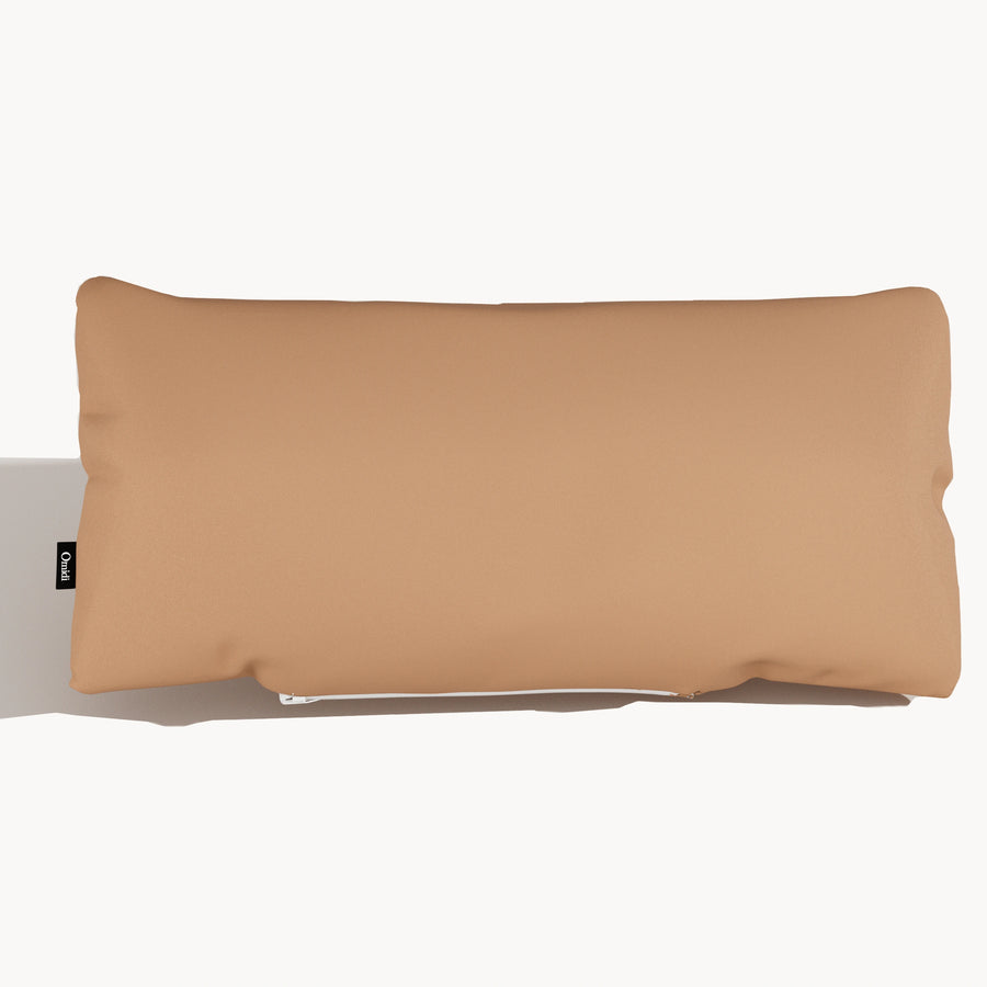 Camel full-grain leather cushion with smooth surface and side tag