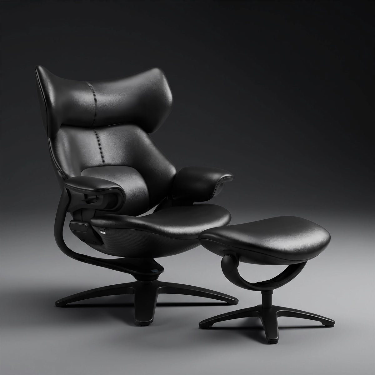 Black recliner lounge chair with matching ottoman, side view with curved headrest
